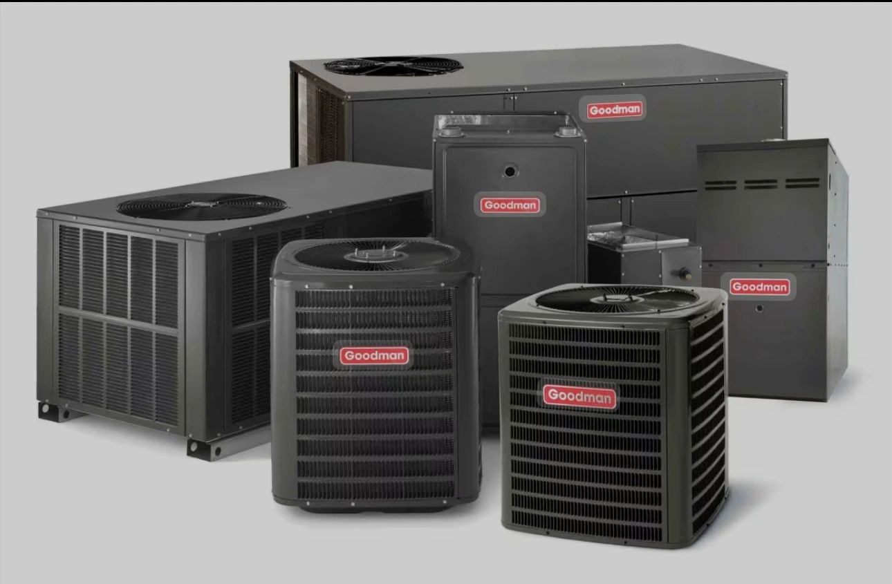 A lineup of residential HVAC equipment, including a Goodman furnace and air handlers, staged for delivery and installation.